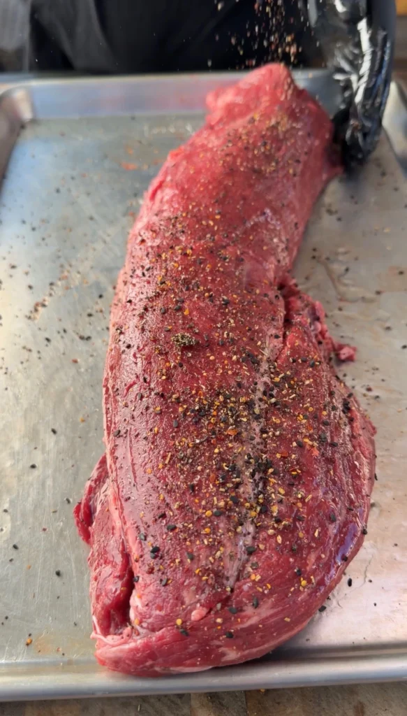 seasoned beef tenderloin on a tray