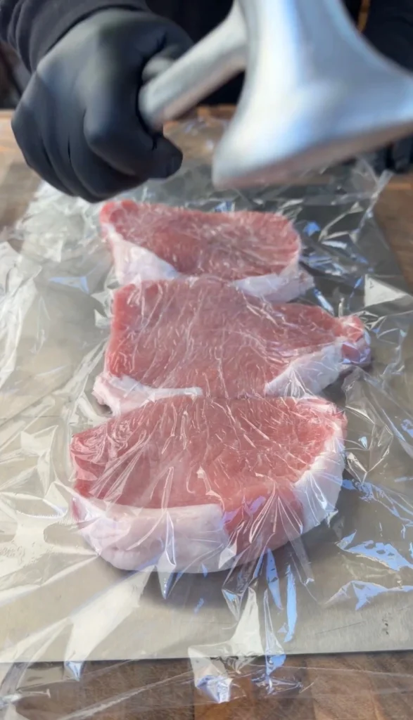 pounded pork chops with cling wrap