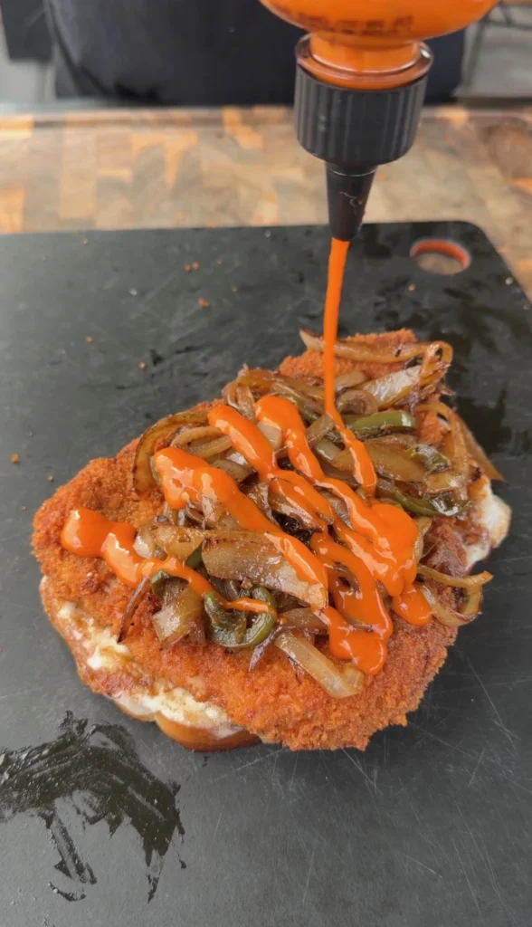 assembling the grilled pork chop sandwiches