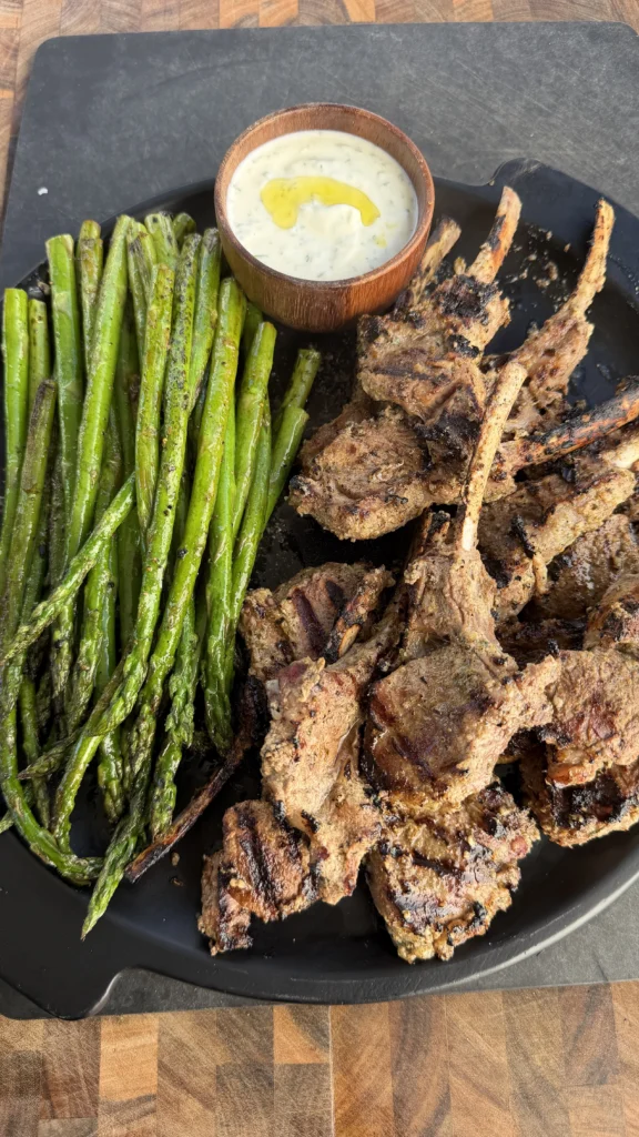 perfect lamb chops on a plate with greens