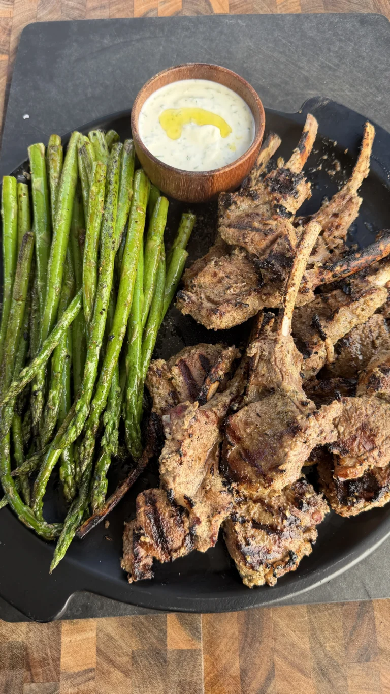 perfect lamb chops on a plate with greens