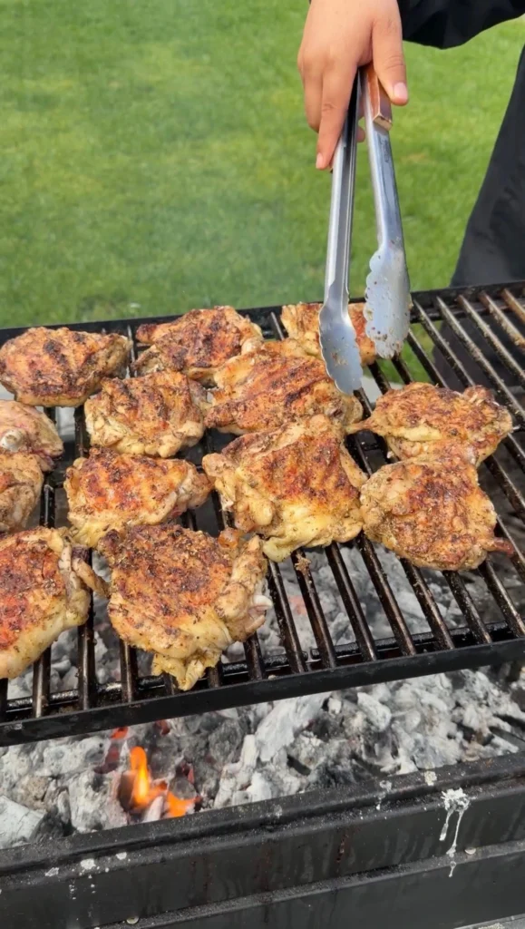 seasoned chicken thighs on the grill