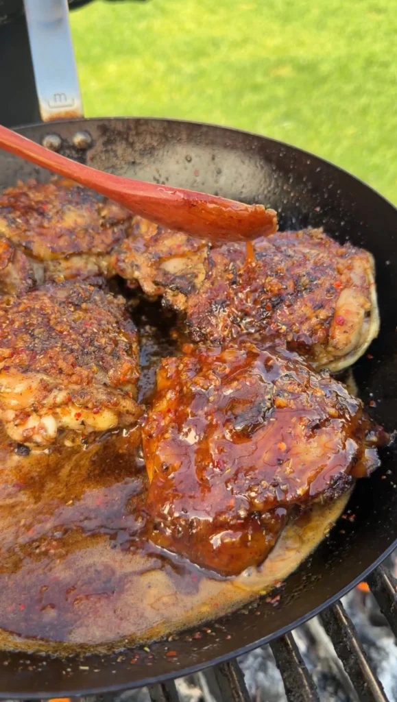 glazed chicken thighs in the pan