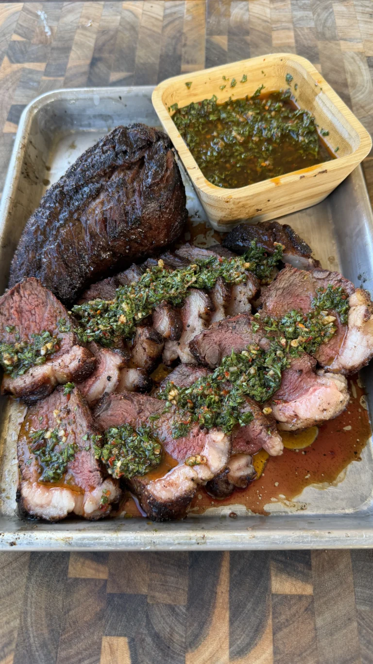 picanha steaks on a cutting board with chimichurri