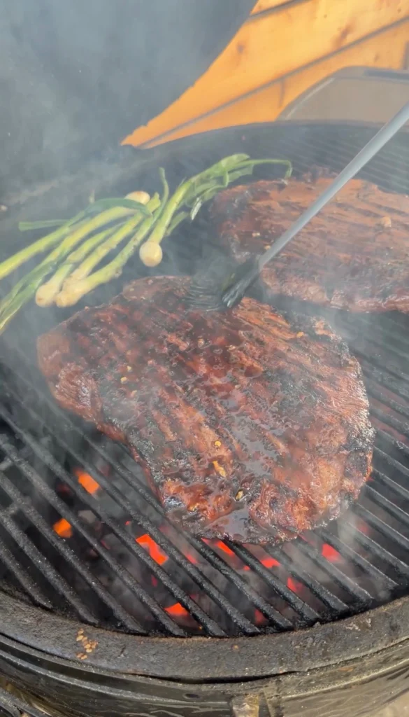 up close on the grilled flank steak on the grill