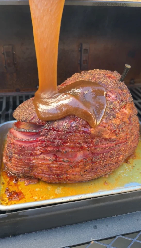 glazed spiral ham on a metal tray