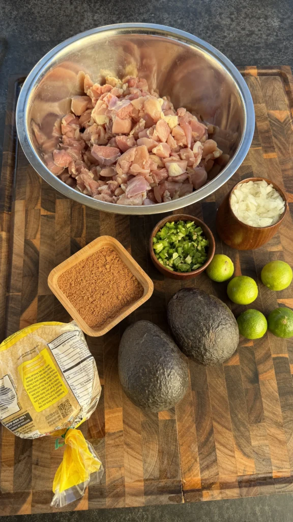 sliced chicken thighs in the bowl with ingredients