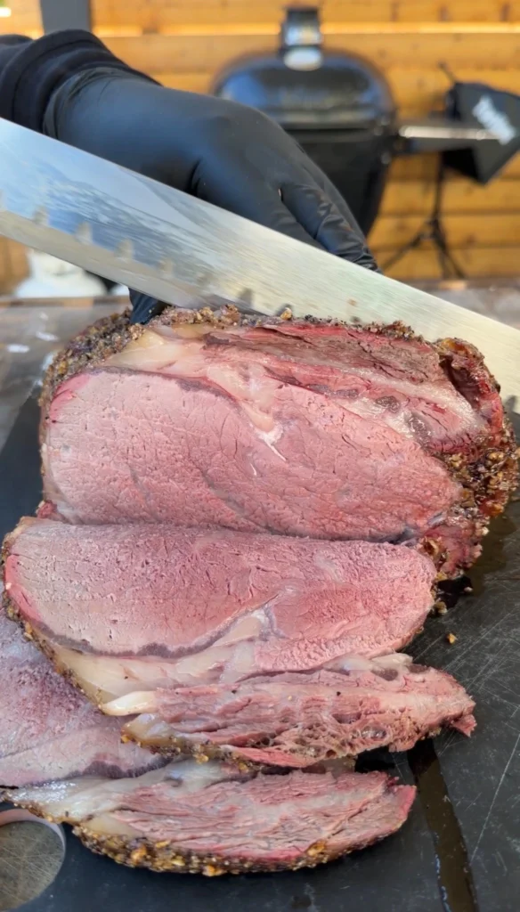 sliced prime rib on a cutting board
