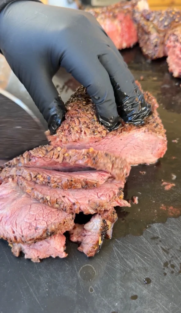 sliced ribeye on a cutting board