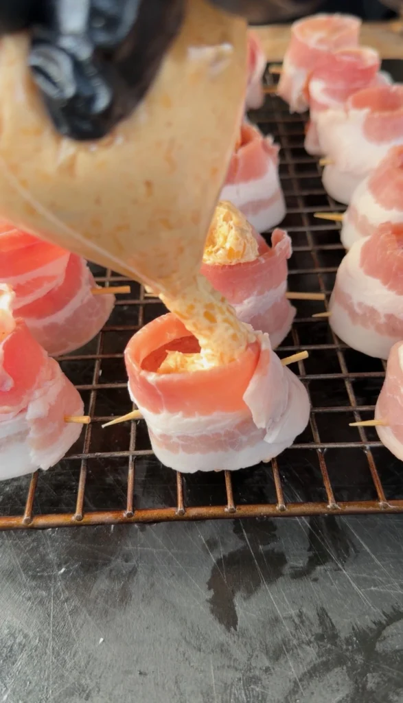 putting cream cheese filling inside the pig shots