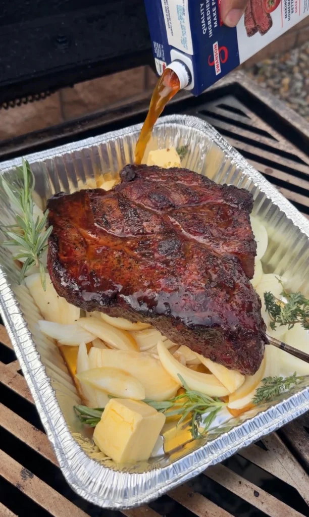 braising ingredients and pan on the smoker