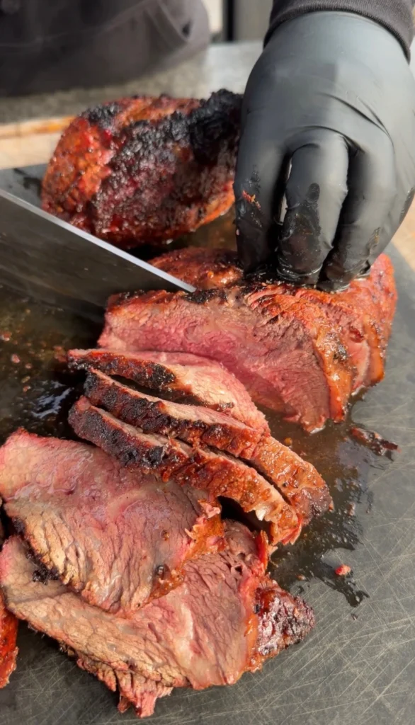 sliced tri tip on a cutting board