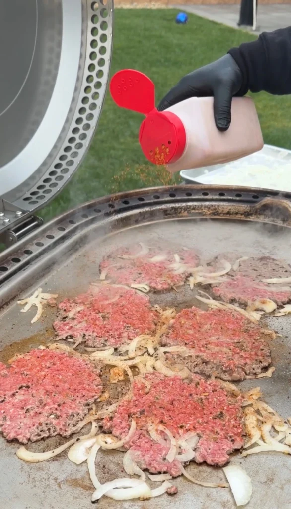 smashed burgers on the grill
