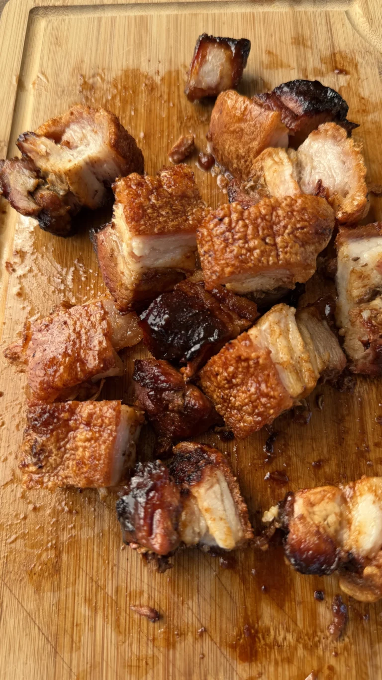 chicharron-plated.webpSmoked pork belly burnt ends with puffed crispy chicharrón skin on a plate