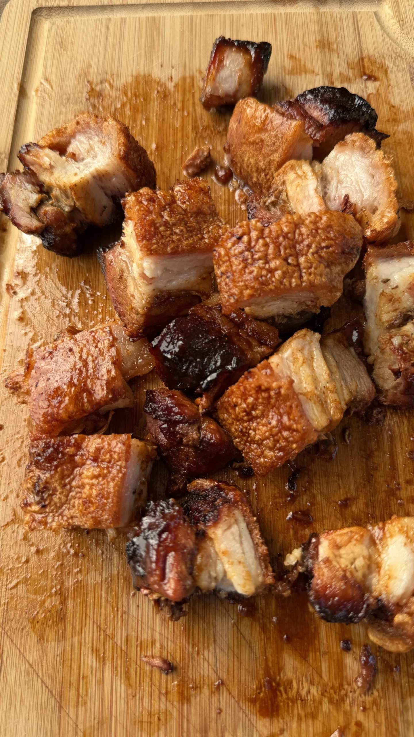 chicharron-plated.webpSmoked pork belly burnt ends with puffed crispy chicharrón skin on a plate