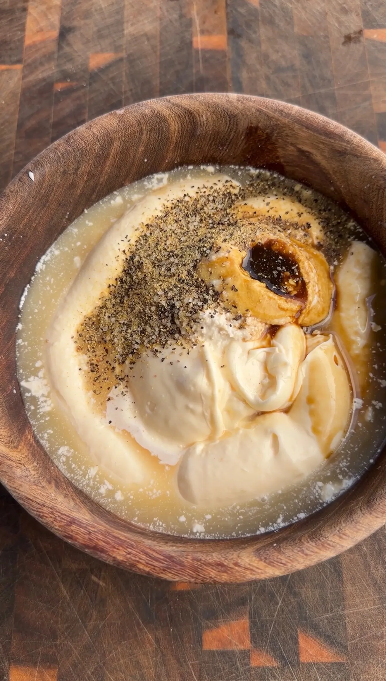 Applewood smoked half chicken in wooden bowl seasoned