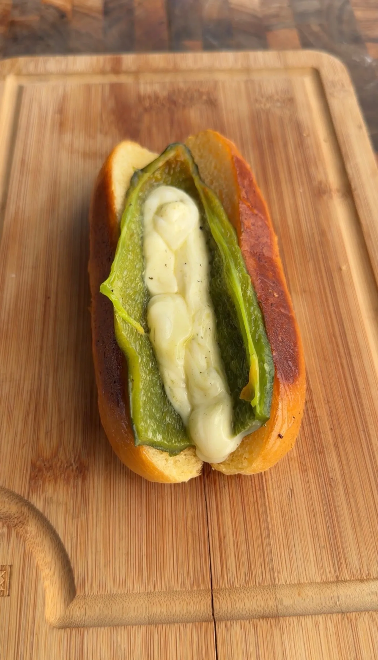 Bacon-wrapped chile relleno hot dog cross section