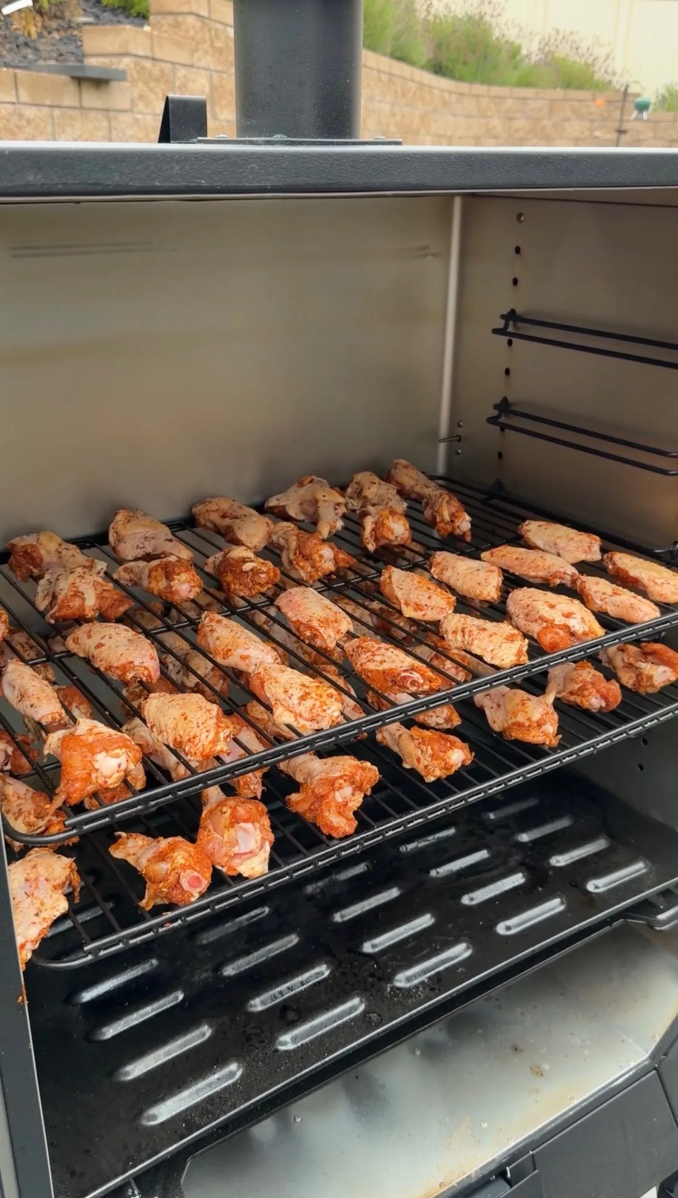 Fast smoked wings cooking on grill grates