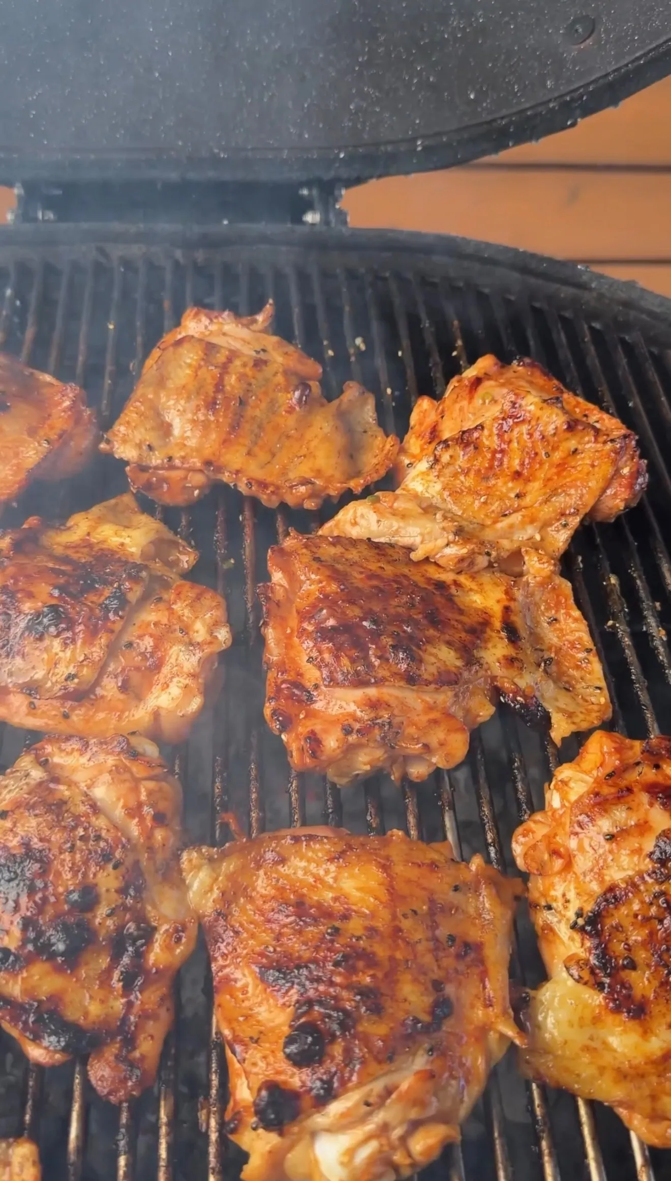 Garlic chili sesame chicken thighs grilling on BBQ