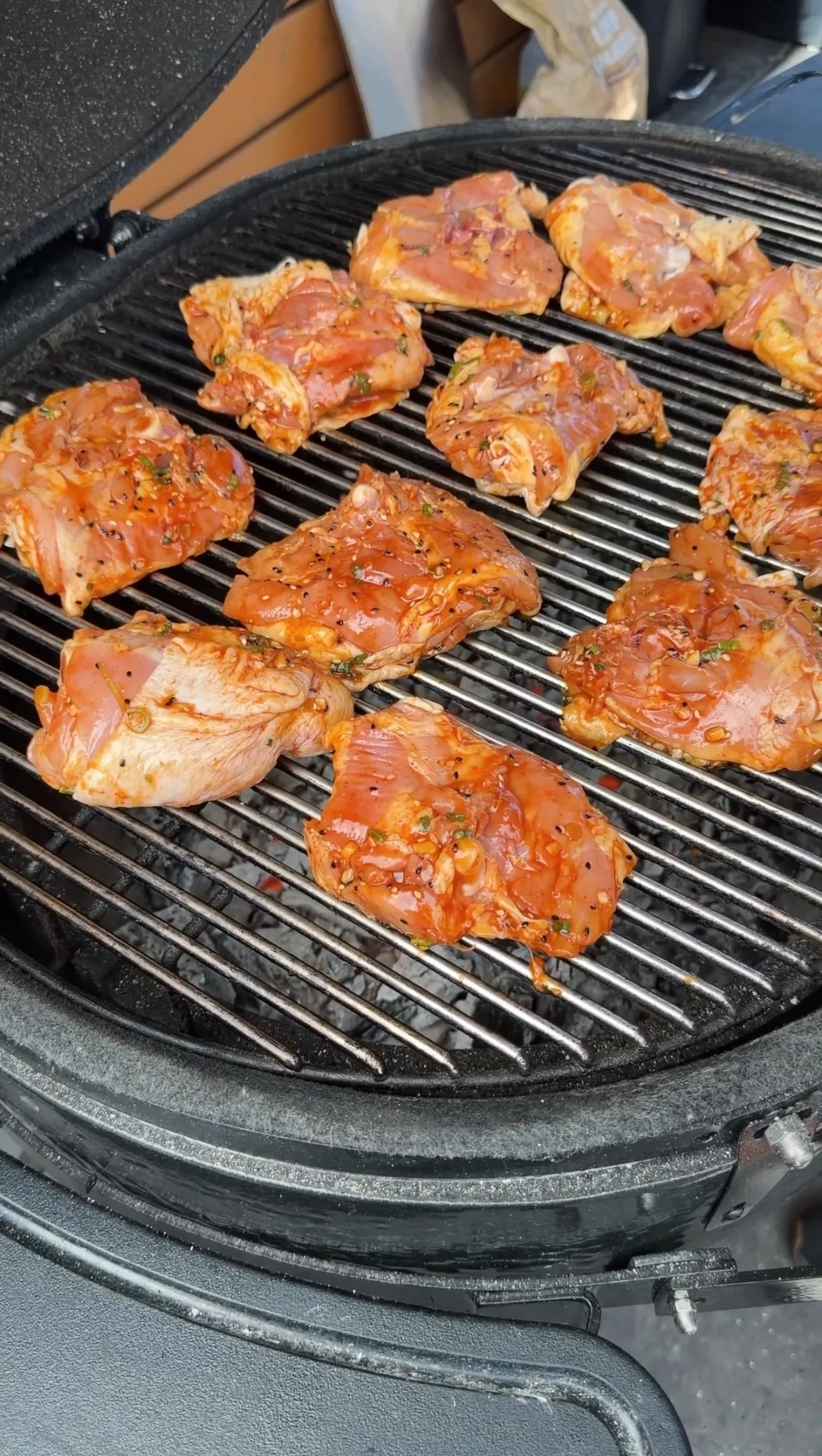 Garlic chili sesame chicken thighs grilling on grates