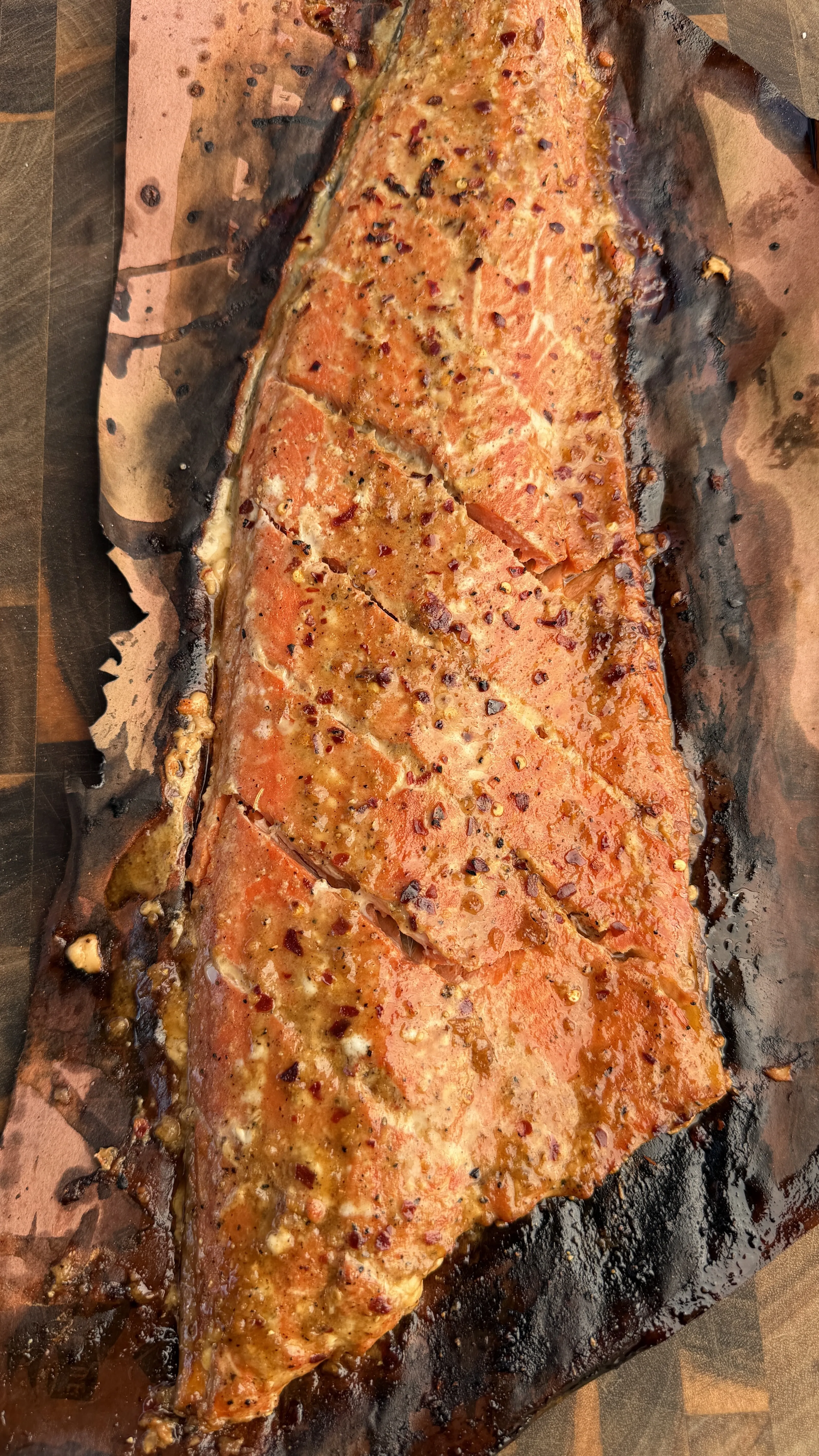 Garlic soy honey smoked salmon sliced on cedar plank
