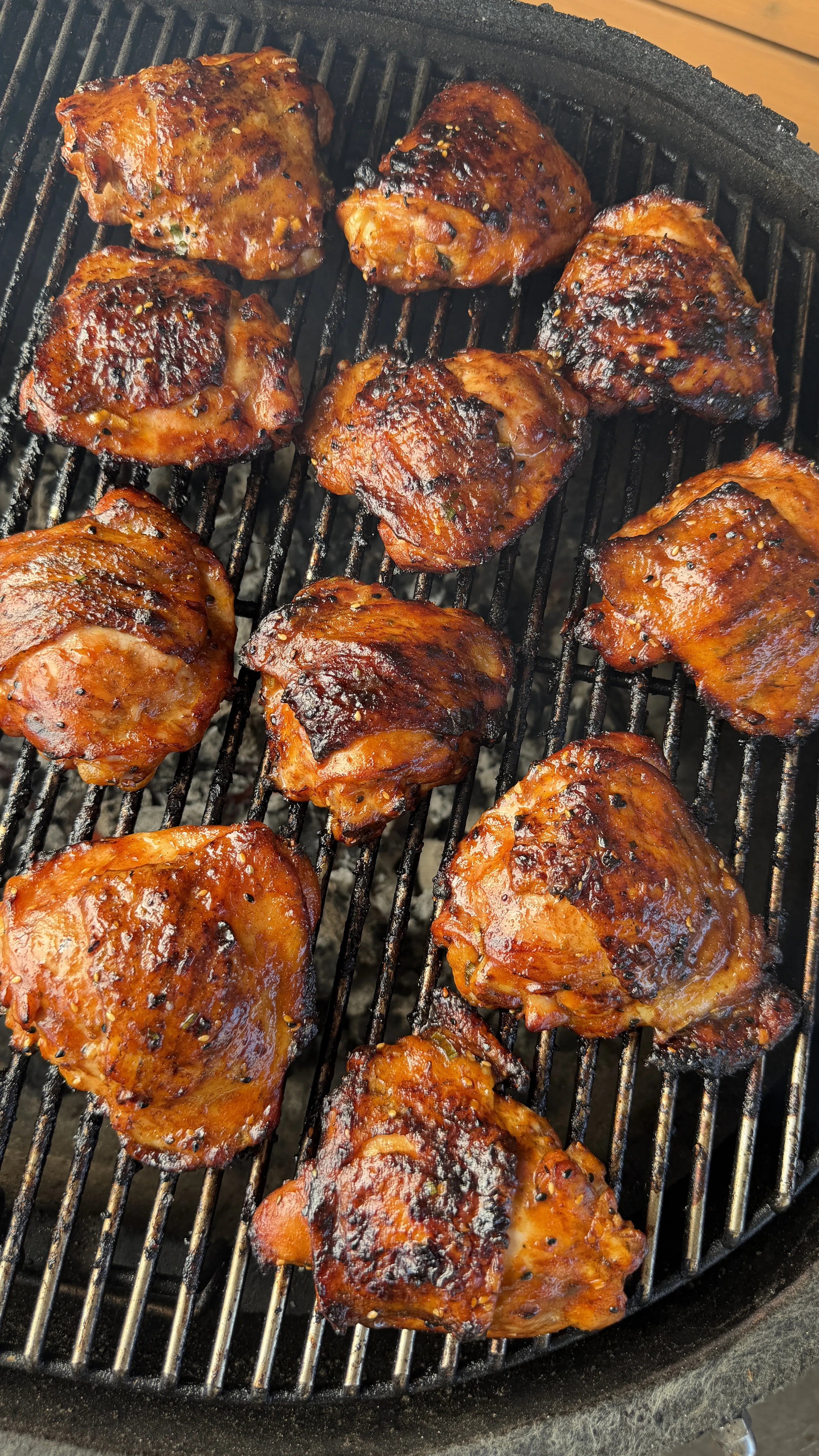 Grilled garlic chili sesame chicken thighs on grill