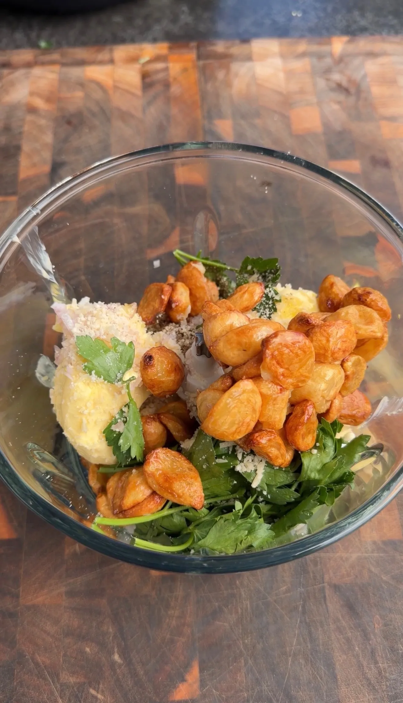 Butter compound ingredients with herbs and cheese in bowl