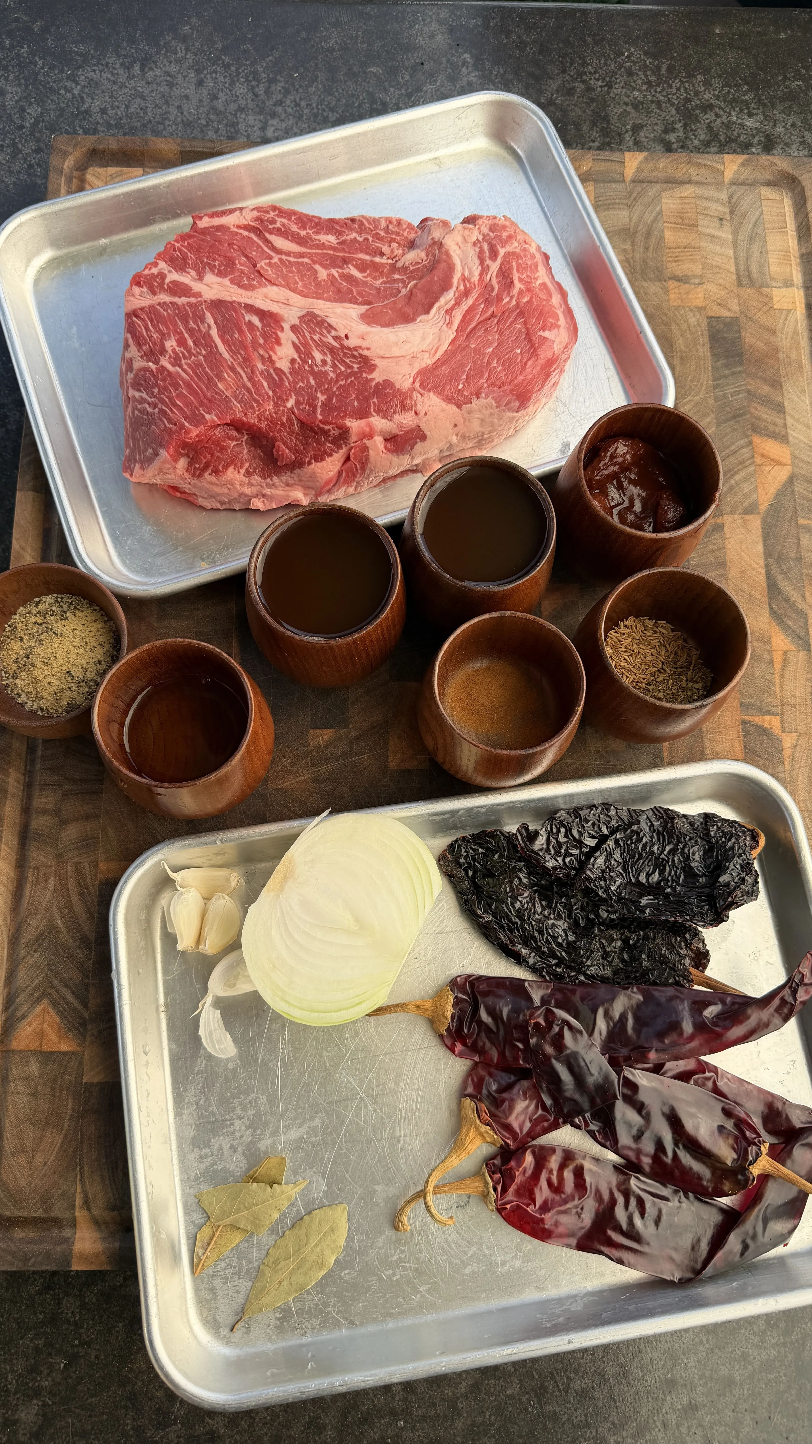 Raw beef and birria spices ingredients during prep