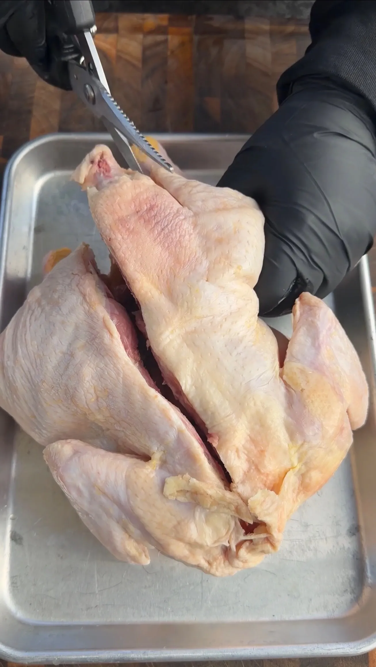 Raw chicken halves prepped for smoking