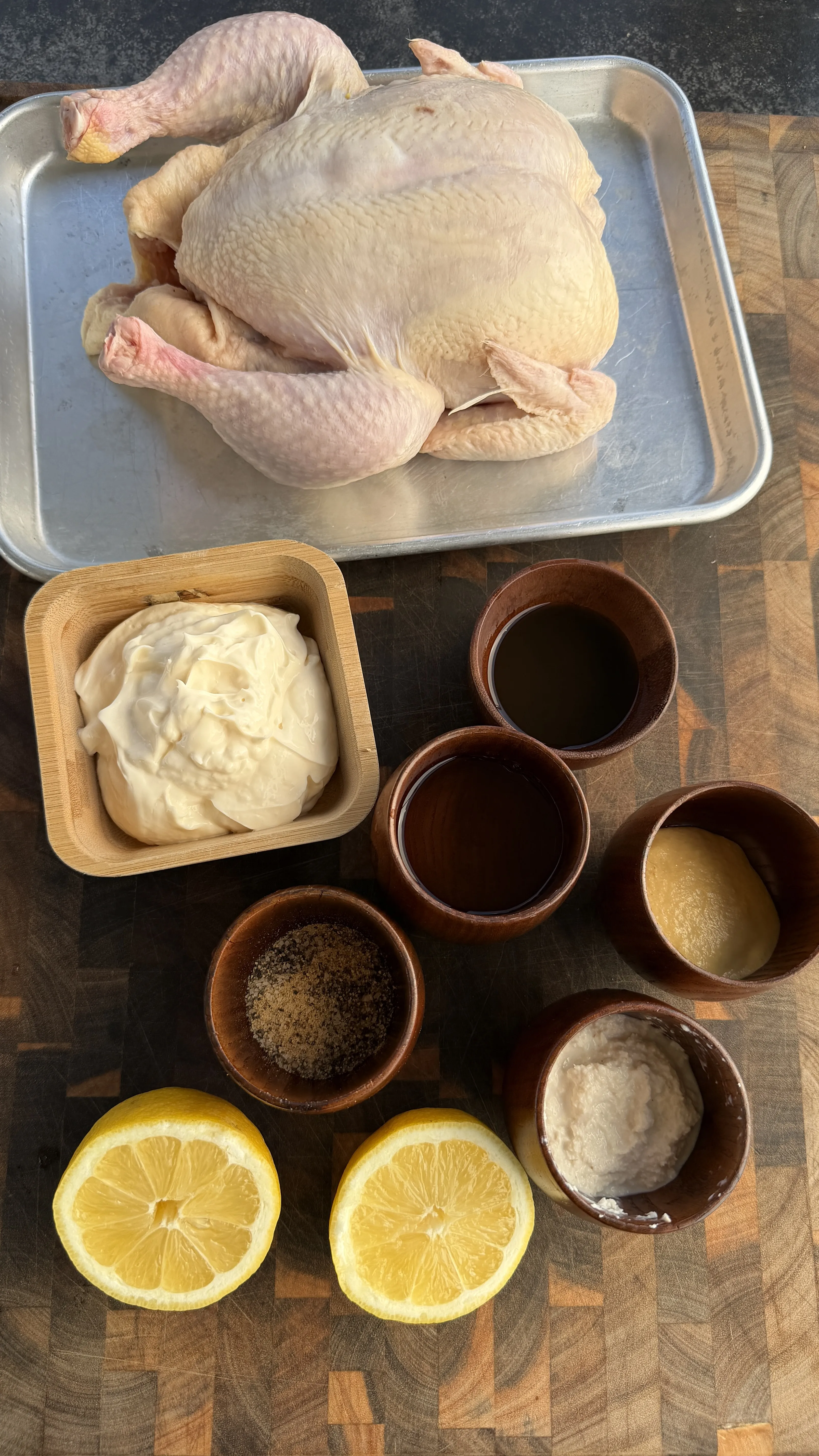 Raw chicken and ingredients for applewood smoking preparation
