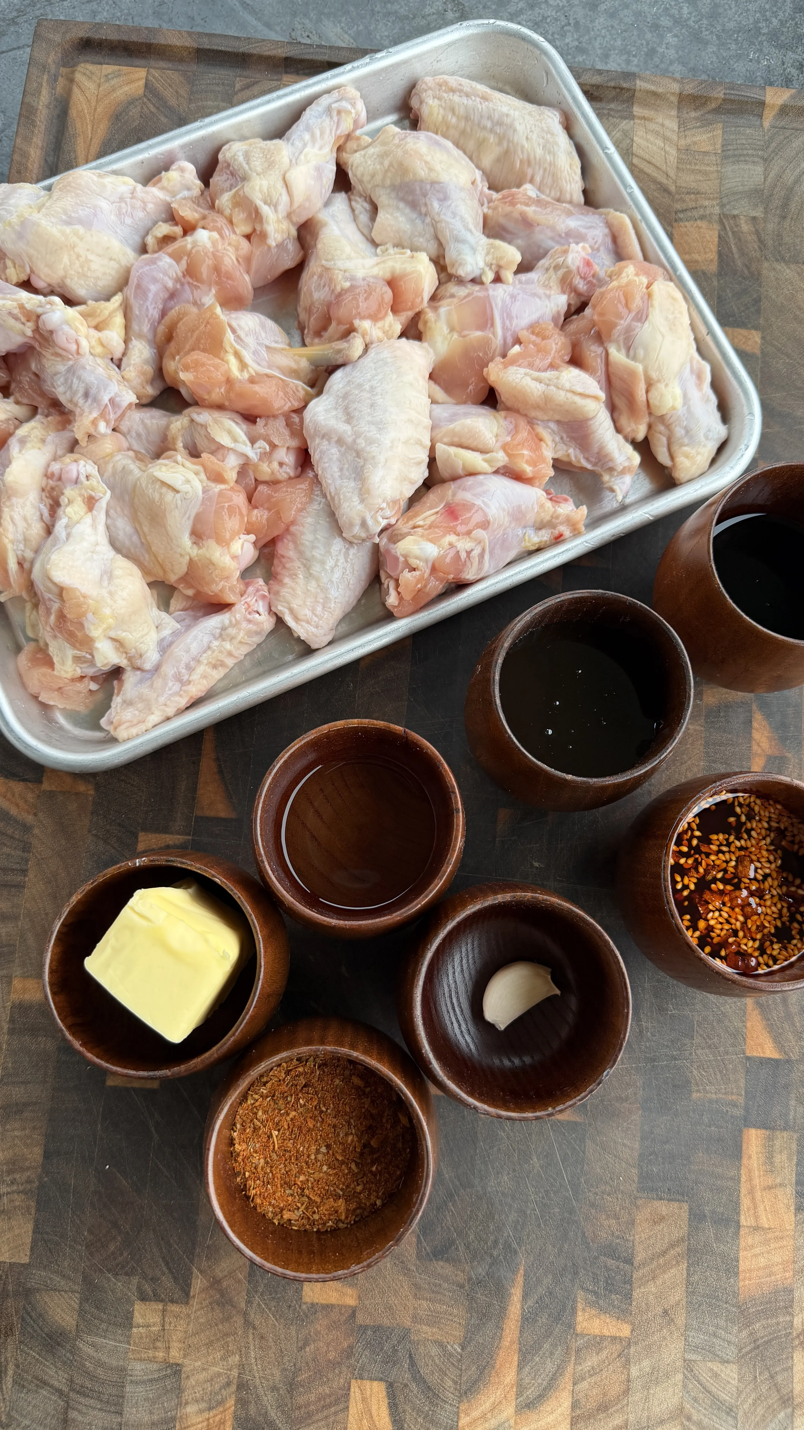 Raw chicken wings and ingredients for smoking preparation