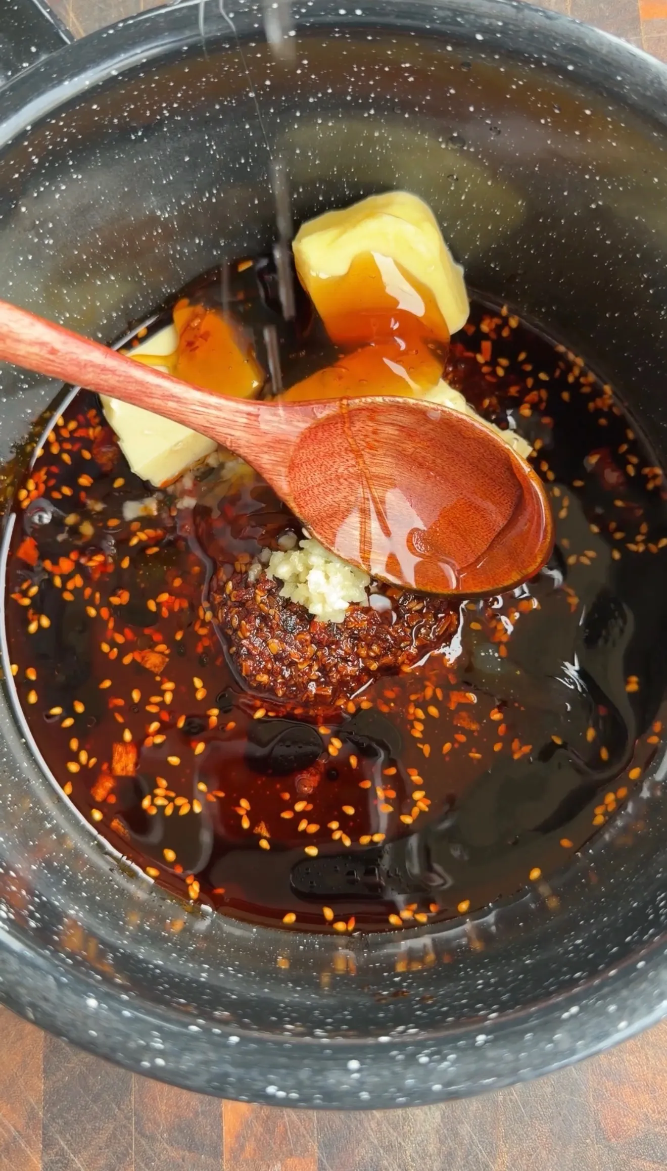 Spicy wing sauce cooking in pan