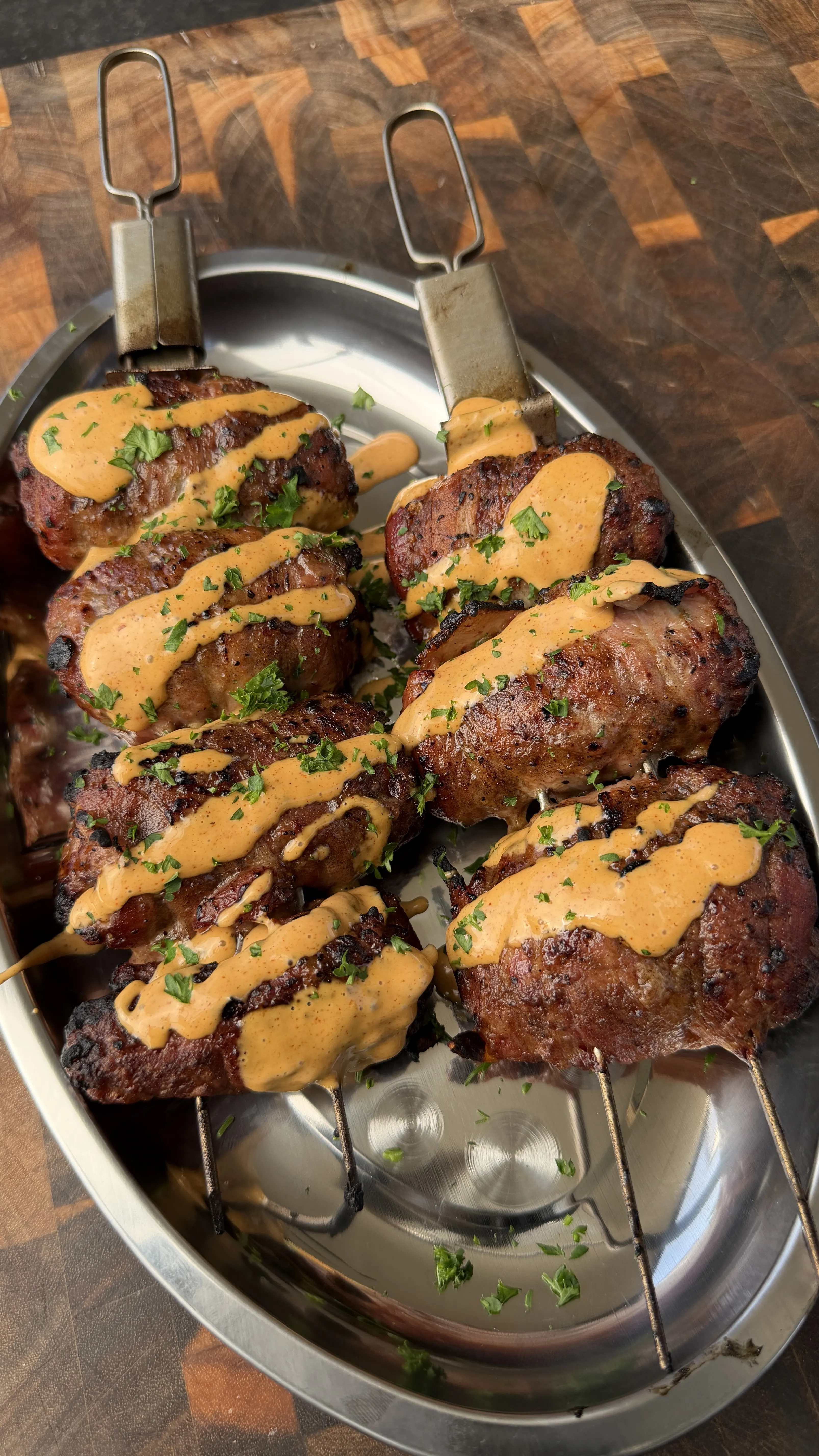 Bacon-wrapped jalapeño beef skewers with sauce
