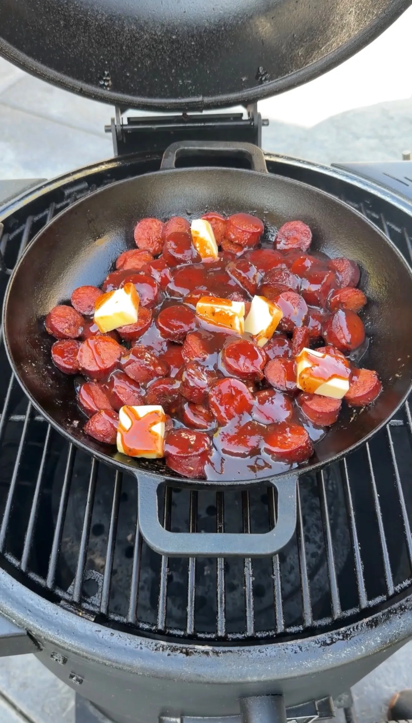 BBQ smoked sausage burnt ends cooking in pan