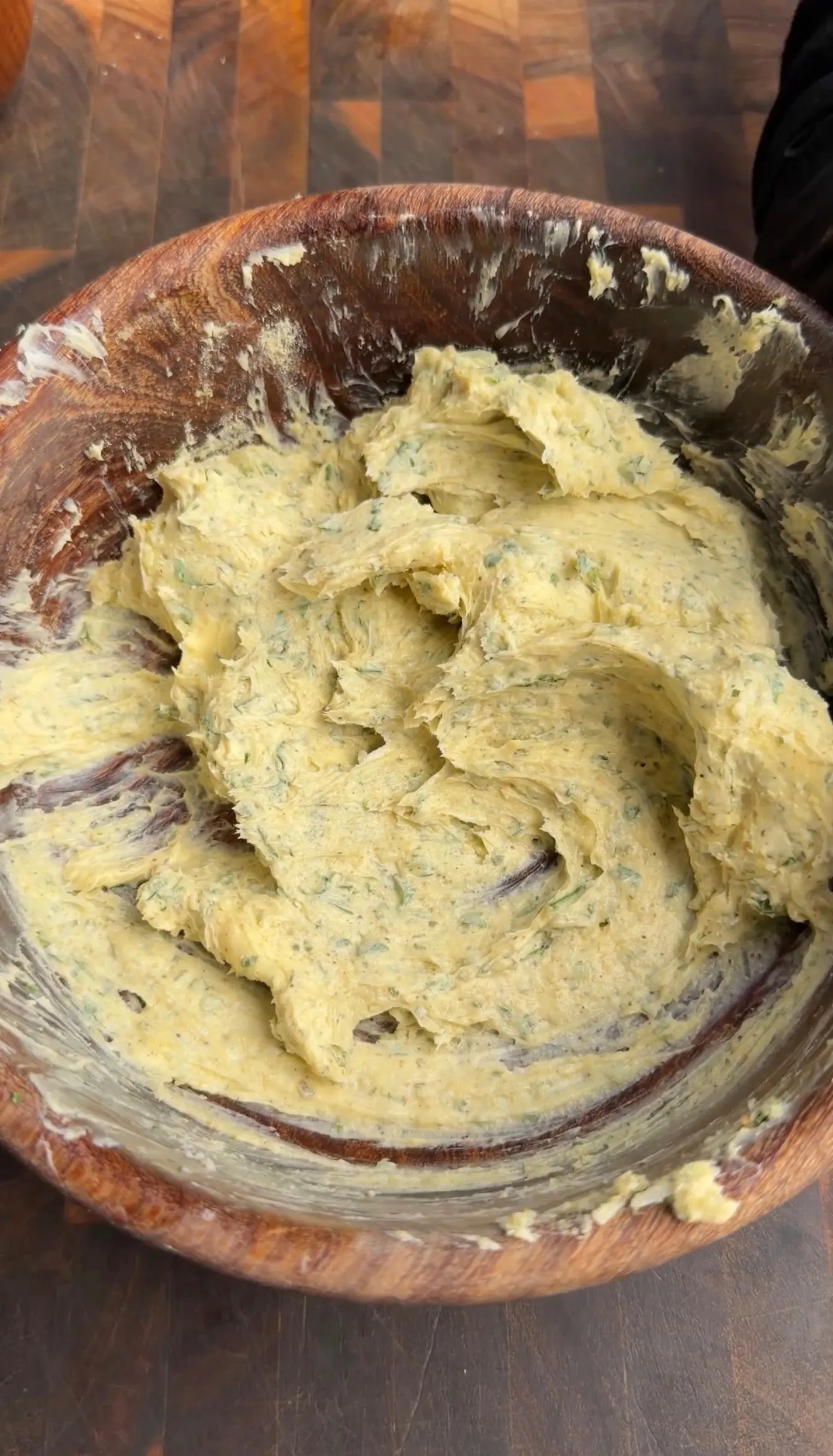 Buffalo chicken ranch butter mixture in wooden bowl