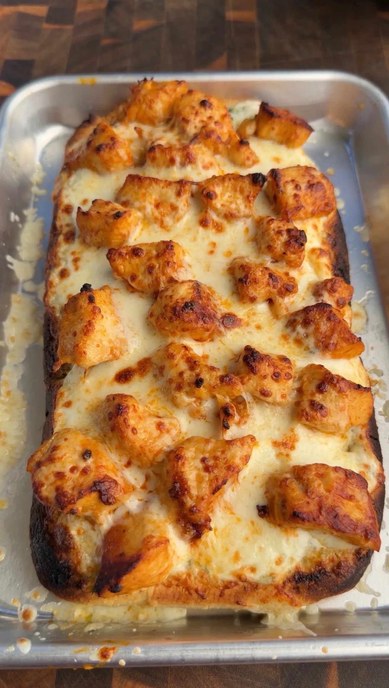 Buffalo chicken ranch flatbread baked with golden cheese