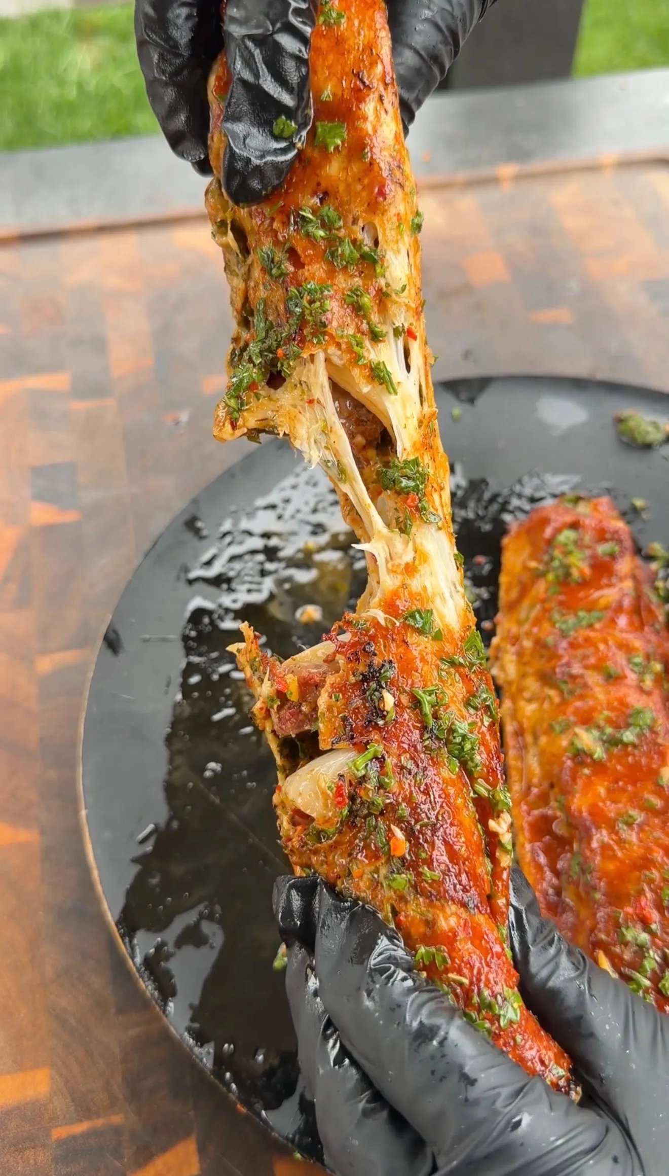 Cheese-crusted chimichurri steak kebab with melted cheese pull