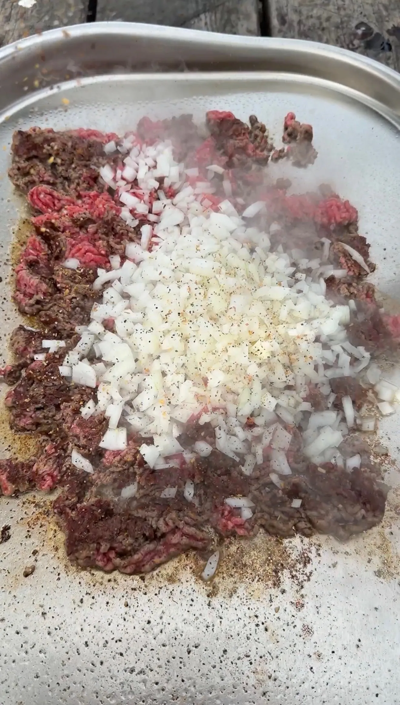 Chopped cheese sandwich meat and onions in mixing bowl