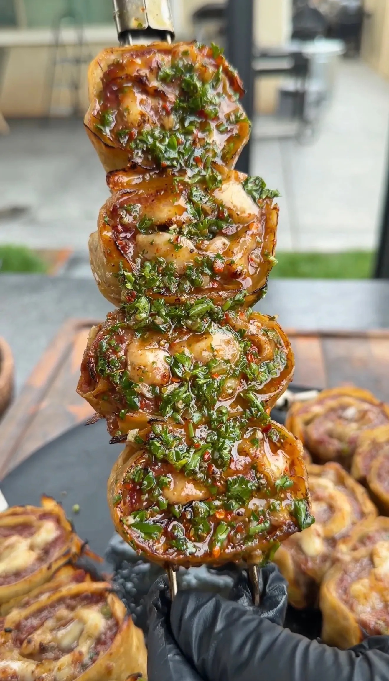 Grilled beef tortilla pinwheels with chimichurri sauce