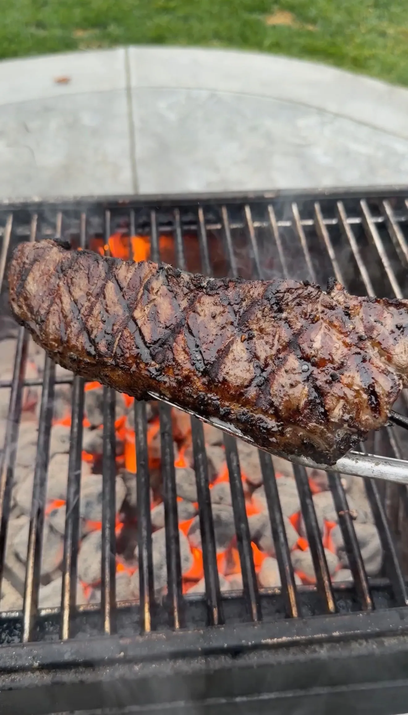 Grilled strip steak with diamond marks on grill
