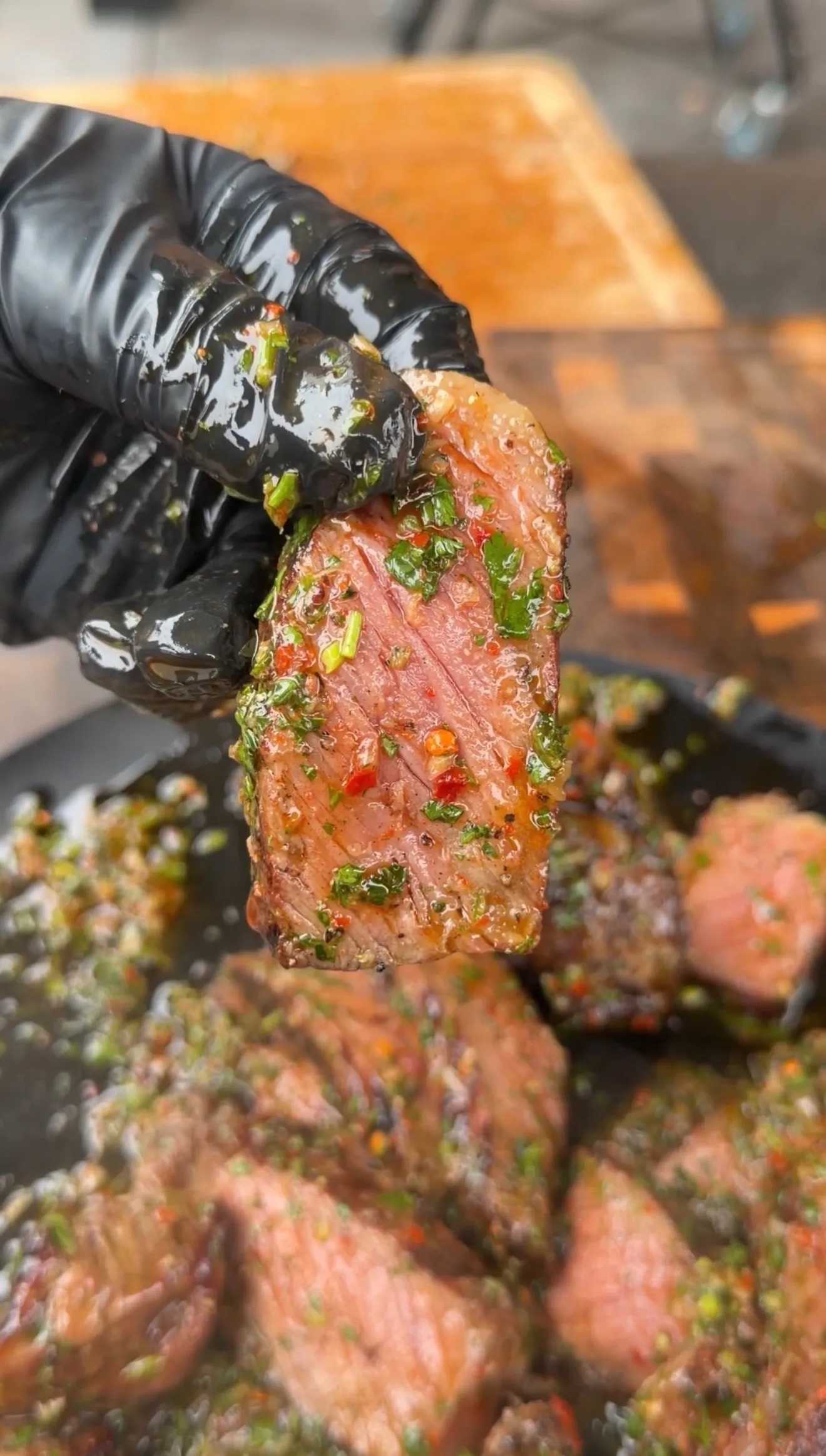 Grilled strip steak with green herb board sauce