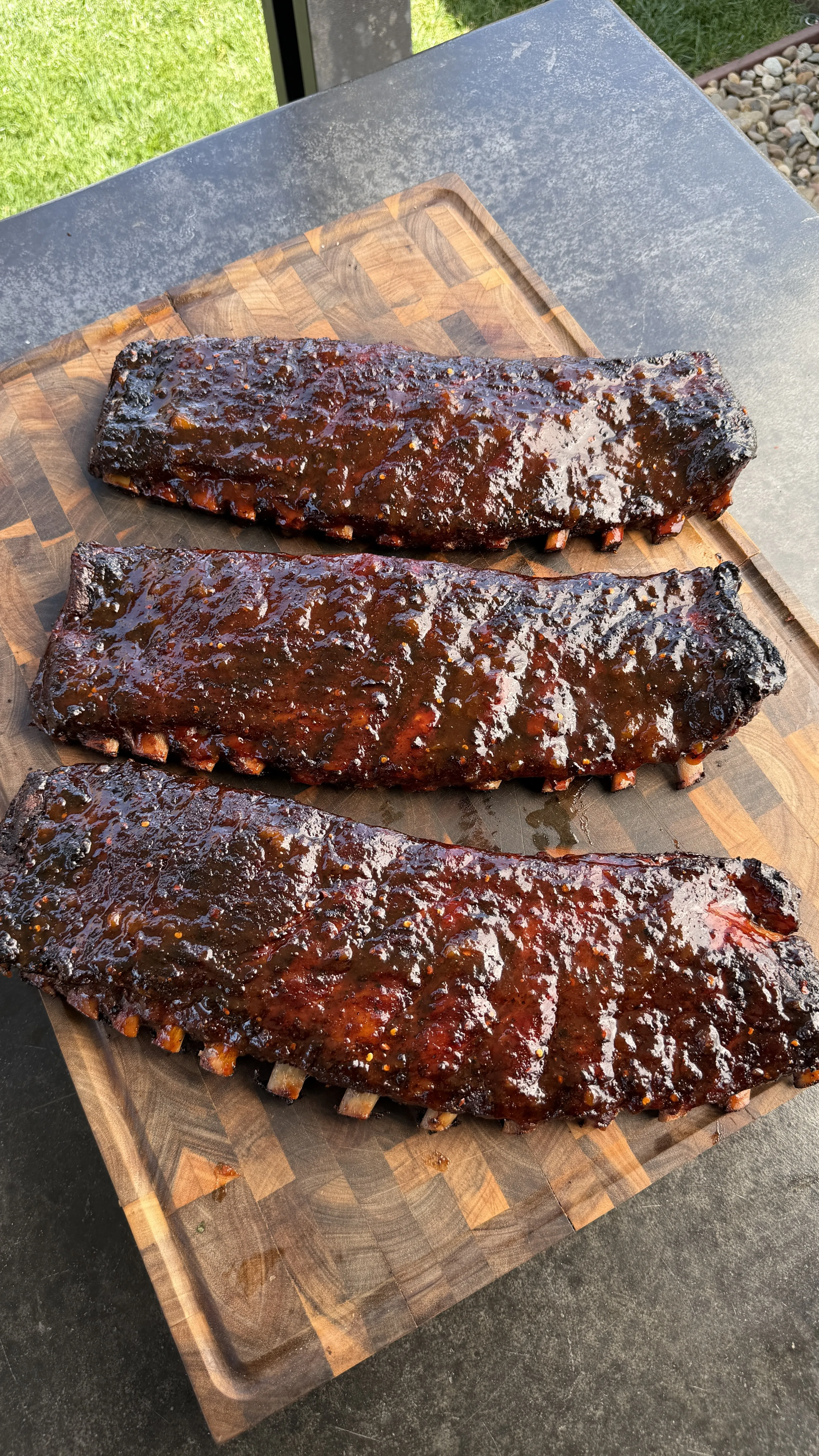 Peach bourbon glazed BBQ ribs on cutting board