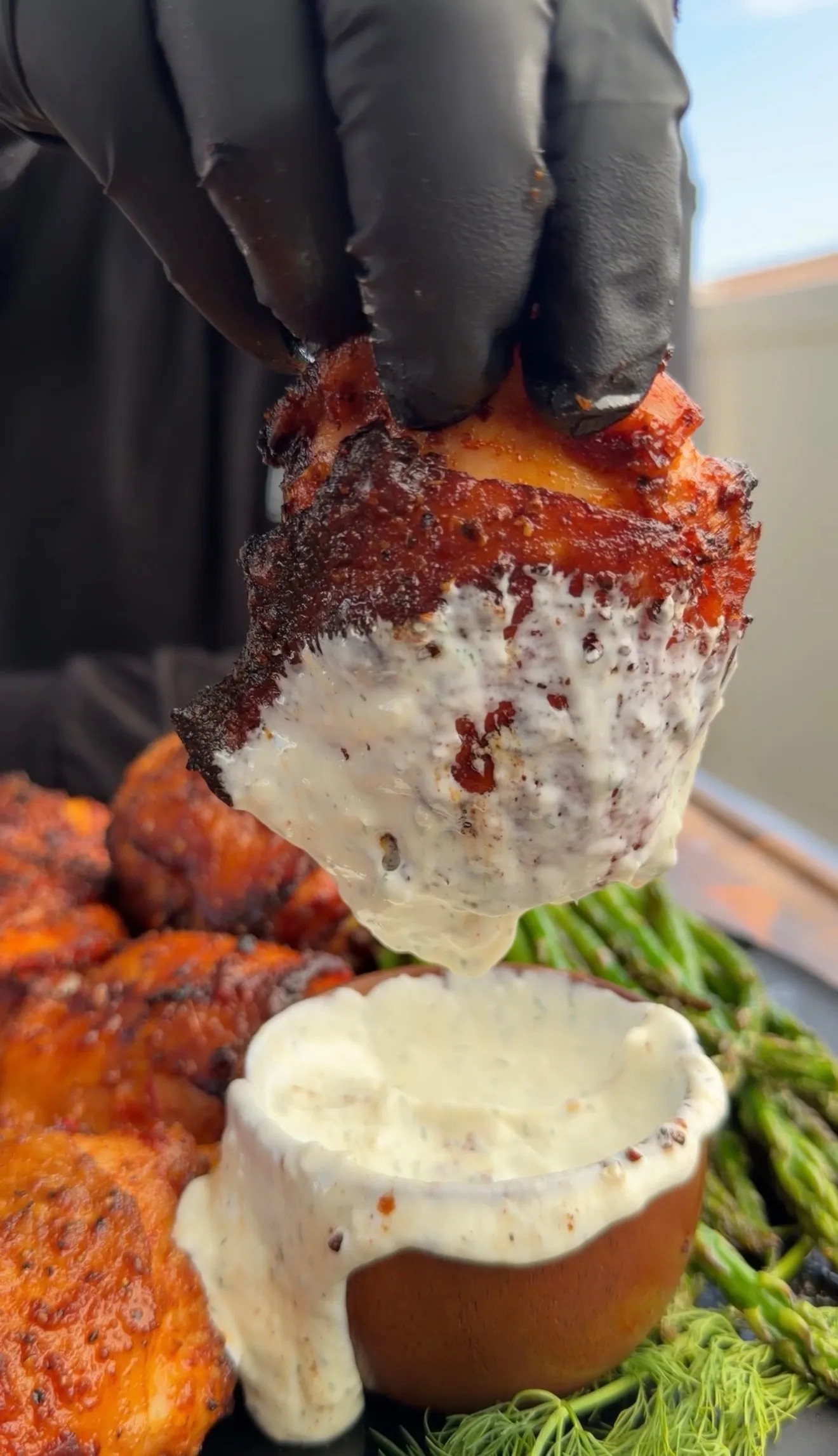 Smoked harissa chicken thigh with sauce