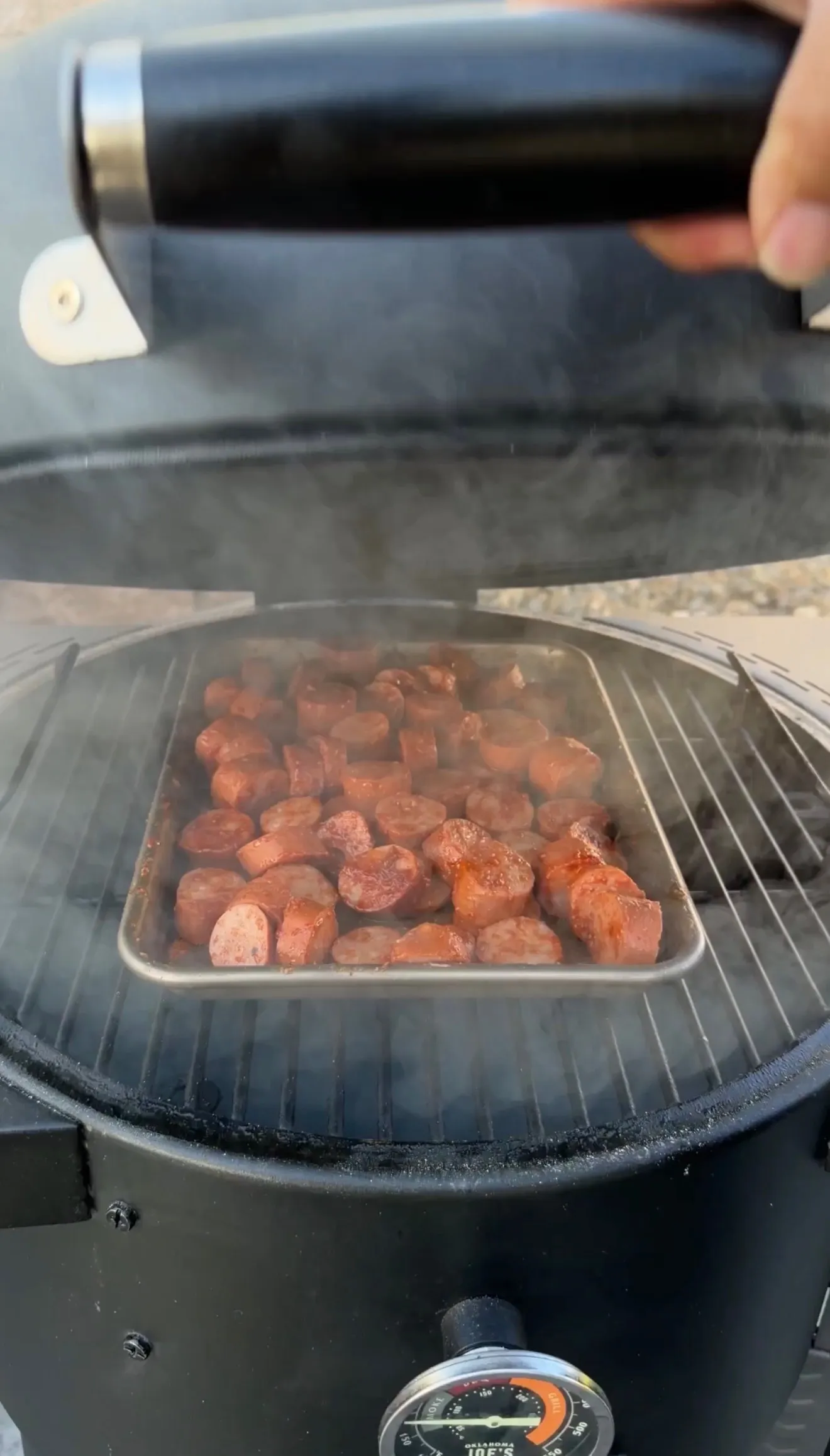 Smoked sausage burnt ends cooking on grill