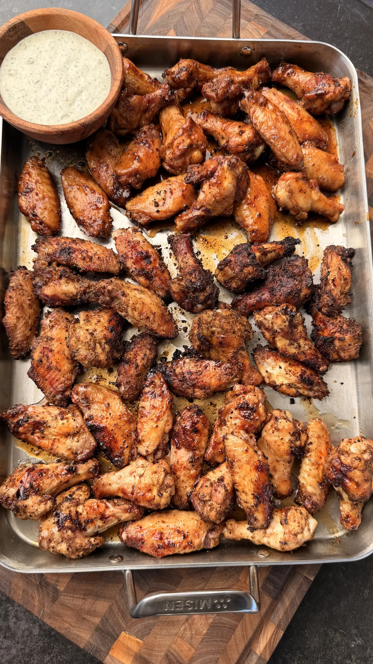 Three-way wings on a sheet pan: jalapeño honey butter, honey lemon pepper, and Cajun-Dano's dry rub with ranch dipping sauce