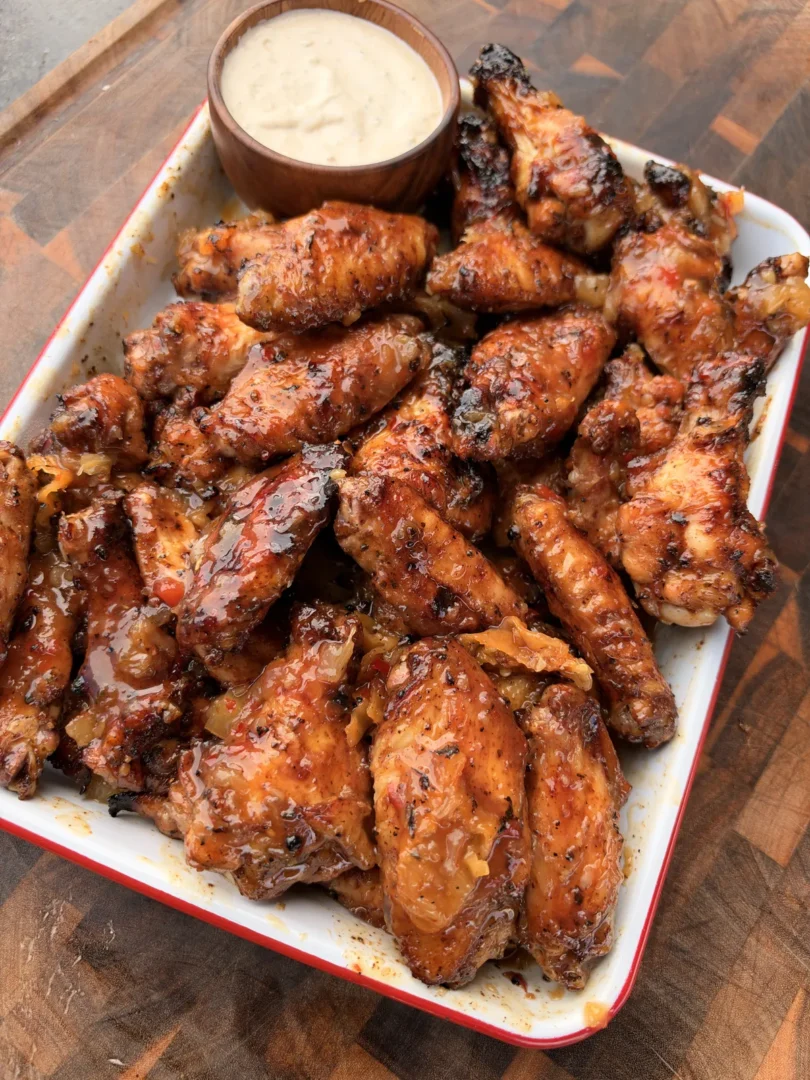 Pineapple habanero grilled chicken wings tossed in sticky sweet-and-spicy glaze served with ranch dipping sauce